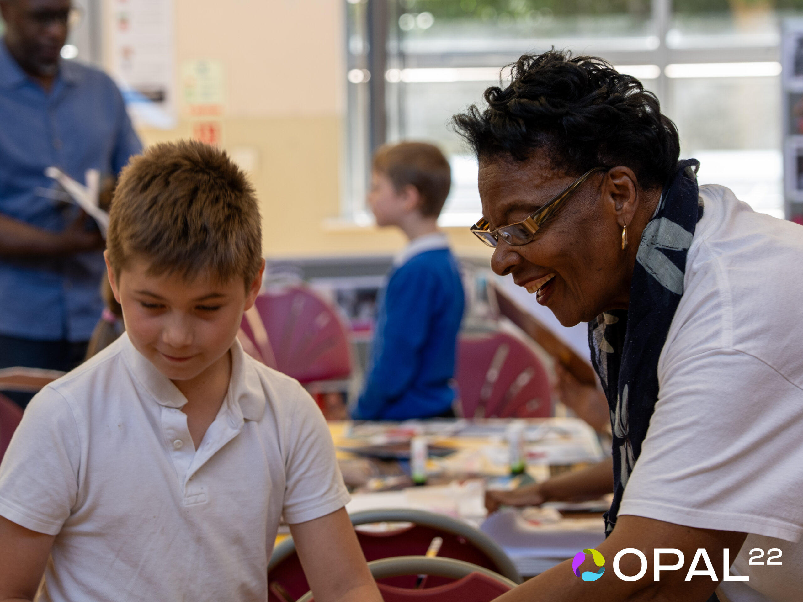 Primary school pupils listening to members of the Windrush Generation during Opal22's Windrush Human Library Workshops in Leicester.